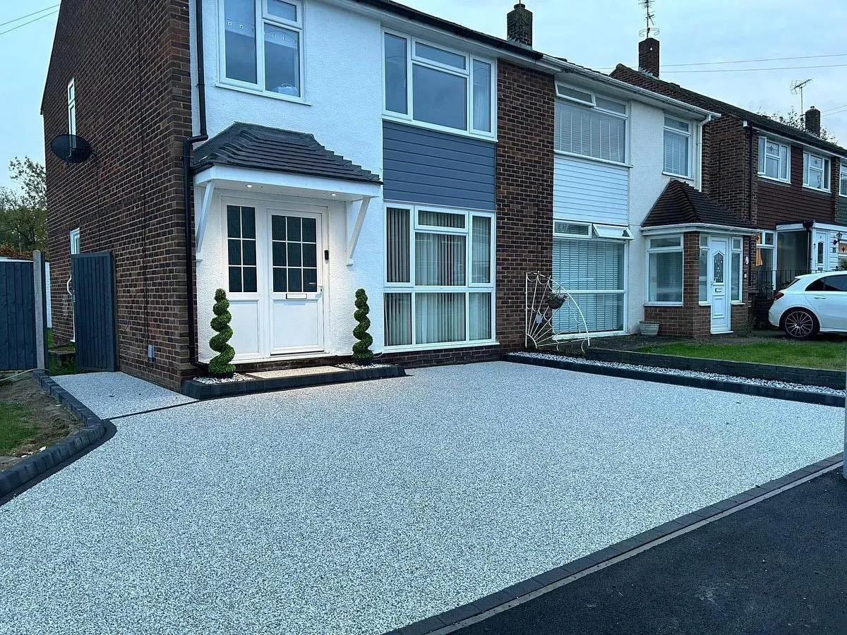 A new resin bound driveway at the front of a semi-detached house