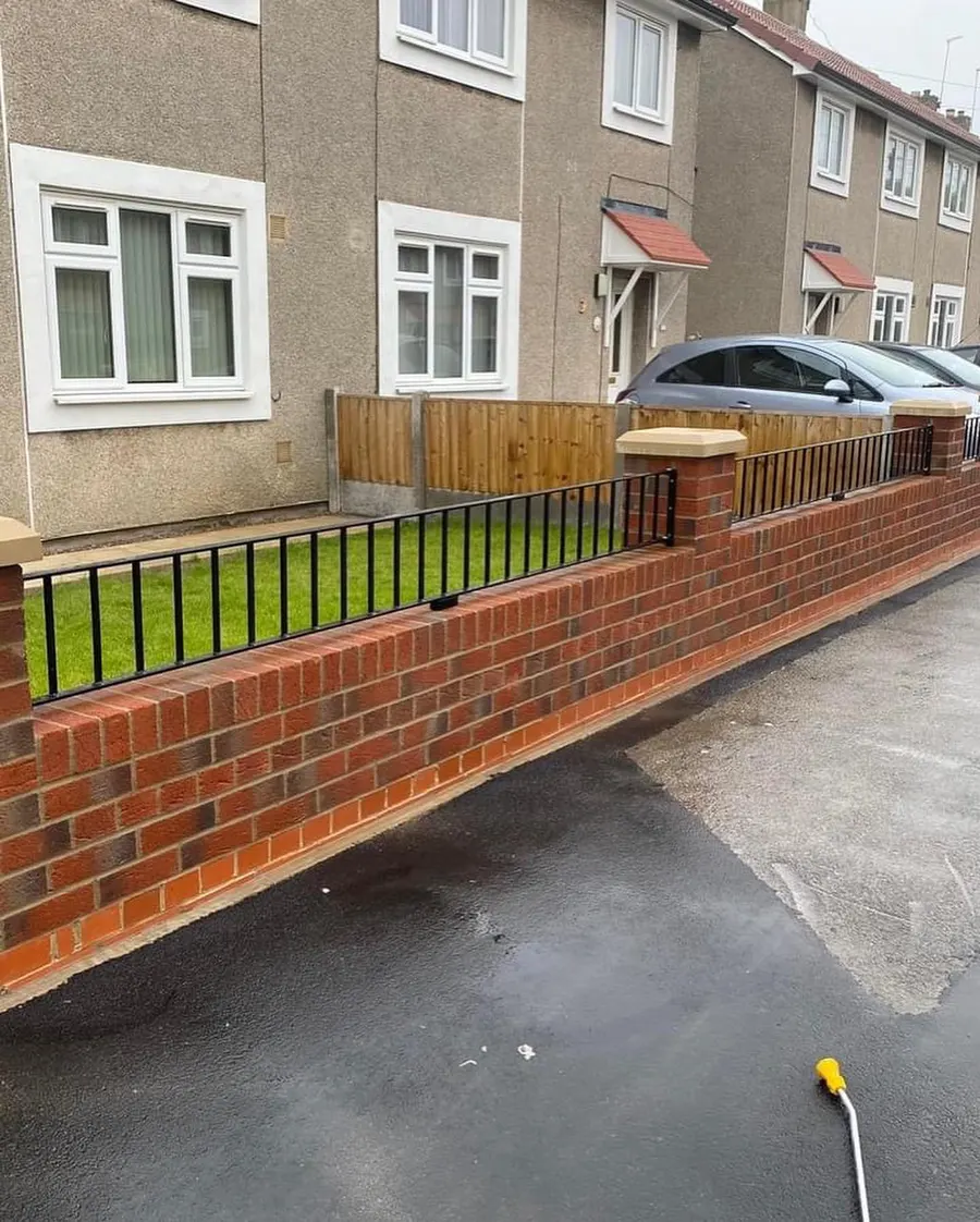 Resin bound driveway with brick wall and railings